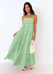 Detailed macro view of the green and white striped pattern on a cotton summer maxi dress