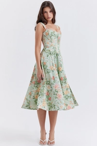 Detail view of floral print midi dress featuring corset bodice and flowy A-line skirt