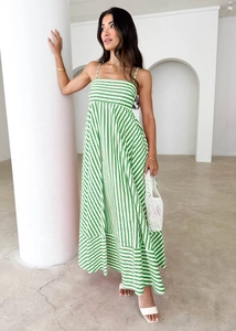Detail view of the green and white striped long dress with high waist and A-line hem