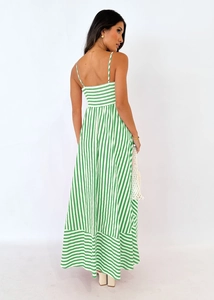 Detail of green and white vertical striped maxi dress with thin straps and open back design
