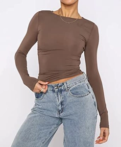 Detail of dark brown slim-fit ribbed long sleeve top paired with light blue jeans