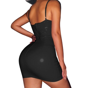 Close-up of slim adjustable straps and smooth fabric on the black bodycon dress