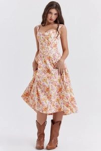 Close-up of floral corset-style dress with gathered waist and flared A-line skirt detail