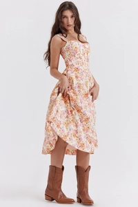 Detailed view of the floral midi dress featuring a vintage corset bodice and side slit
