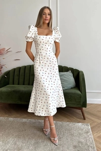 Detailed shot of the vintage square collar and floral puff sleeves on this elegant dress