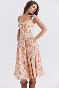 Detail of floral midi dress with corset waist and elegant side pocket on white base