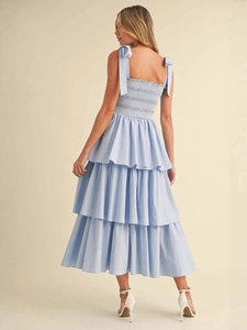 Light blue midi sun dress with tie straps and a tiered ruffled skirt for summer beach wear