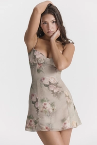Close-up of the floral print and slim fit design on this summer mini sundress