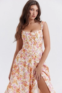 Detail of floral sundress with corset waist, square neckline and high side slit