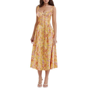 Detailed close-up of French floral dress featuring yellow fabric and pink flower prints