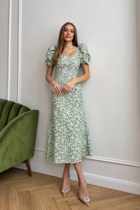 Close-up of floral midi dress featuring vintage square neck and elegant puff sleeves