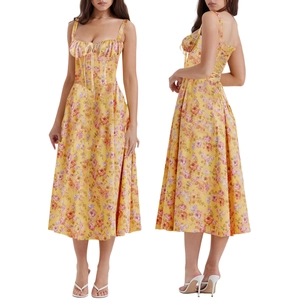 Detail of yellow floral sundress with thin straps, drawstring bust, and A-line skirt hem
