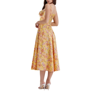 Detail of yellow floral midi dress with spaghetti straps and ruched drawstring chest