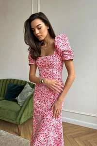 Close-up of elegant floral print dress featuring a square neck and puff sleeves detail