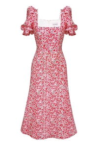 Detail of square neckline and puff sleeves on floral short sleeve dress with brand tag