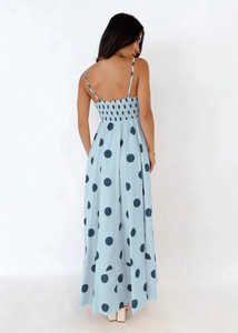 Detail of the back cross-straps and elastic smocking on the blue polka dot maxi dress