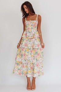 Detail of multi-layer floral tiered dress with square neck and pink yellow flower patterns