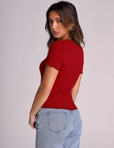 Detail view of the red ribbed slim fit T-shirt featuring elegant lettuce hem design