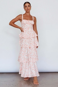 Detail view of tiered floral maxi dress showing ruffled layers and orange flower print