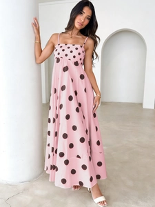 Pink polka dot maxi dress with thin straps and large A-line skirt for summer