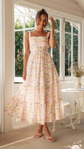 Detail of square neck floral tiered dress with pink patterns for summer resort style