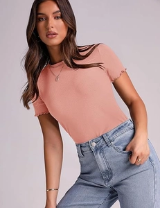 Detail of pink ribbed knit t-shirt featuring elegant lettuce trim on the short sleeves