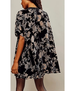 Detail view of the back zipper and floral velvet fabric on a vintage mini dress