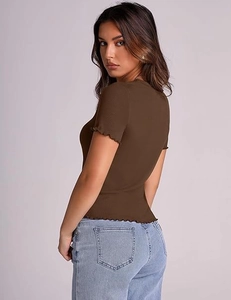Close-up of brown ribbed short sleeve T-shirt with lettuce edge trim details
