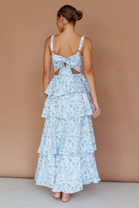 Detail of blue floral maxi dress featuring elegant back cutout and bow tie design