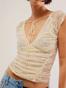Slim fit beige lace backless crop top with floral embroidery and V-neck tie detail