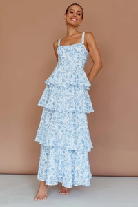 Detail view of square neck floral maxi dress with tiered skirt and blue white print