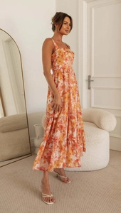 Floral print summer maxi dress with spaghetti straps and tiered skirt for a stylish vacation