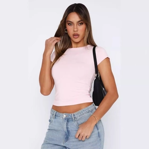Slim fit light pink crew neck t-shirt for women paired with denim jeans and a black bag