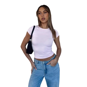 Slim fit light pink crew neck T-shirt for women paired with denim jeans and black bag