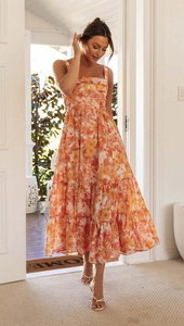 Detailed view of the square neck and floral tiered skirt on this summer midi dress