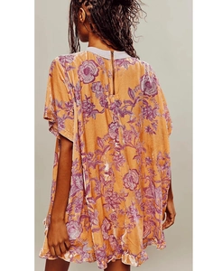 Detail view of the yellow velvet dress back with purple floral print and zipper closure