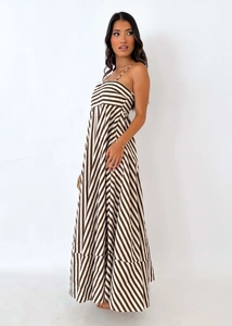 Detail of the brown and white striped patterns on a summer maxi dress with A-line skirt