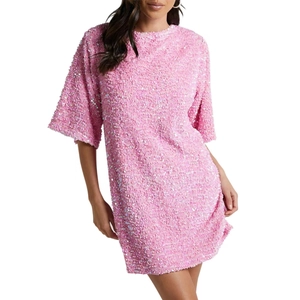 Close-up of pink sequined velvet dress showing shimmering texture and short sleeve detail