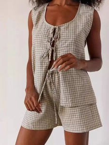 Women's minimalist plaid two-piece set featuring sleeveless tie-front top and elastic shorts