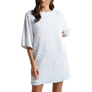 Detailed view of high-density iridescent sequins on a white velvet short sleeve dress