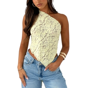 Close-up of pale yellow lace texture and wave hem on a one-shoulder crop top