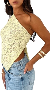 Close-up of intricate pale yellow floral lace texture on a sexy one-shoulder crop top