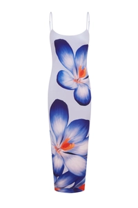 Close-up of white bodycon maxi dress featuring large blue floral prints and slim straps