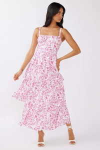 Detail of tiered floral maxi dress showing white and purple bow patterns and delicate straps