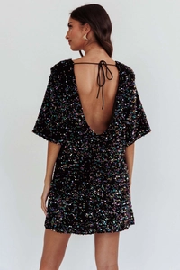 Detail of elegant backless velvet dress with colorful sequins and neck tie closure
