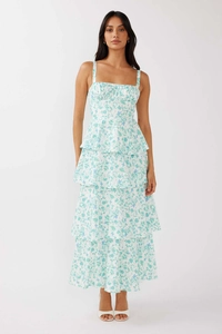 Detail of tiered floral maxi dress with square neckline and delicate blue flower print