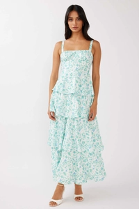 Detail of floral spaghetti strap maxi dress with tiered ruffle layers and bow design