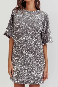 Detailed close-up of sparkling silver sequins and high-quality fabric on this mini dress