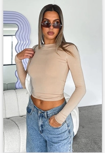 Slim fit long sleeve round neck bodysuit top for women in nude beige color
