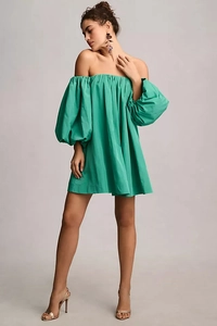 Detail of emerald off-the-shoulder mini dress with puff sleeves and elasticated neckline